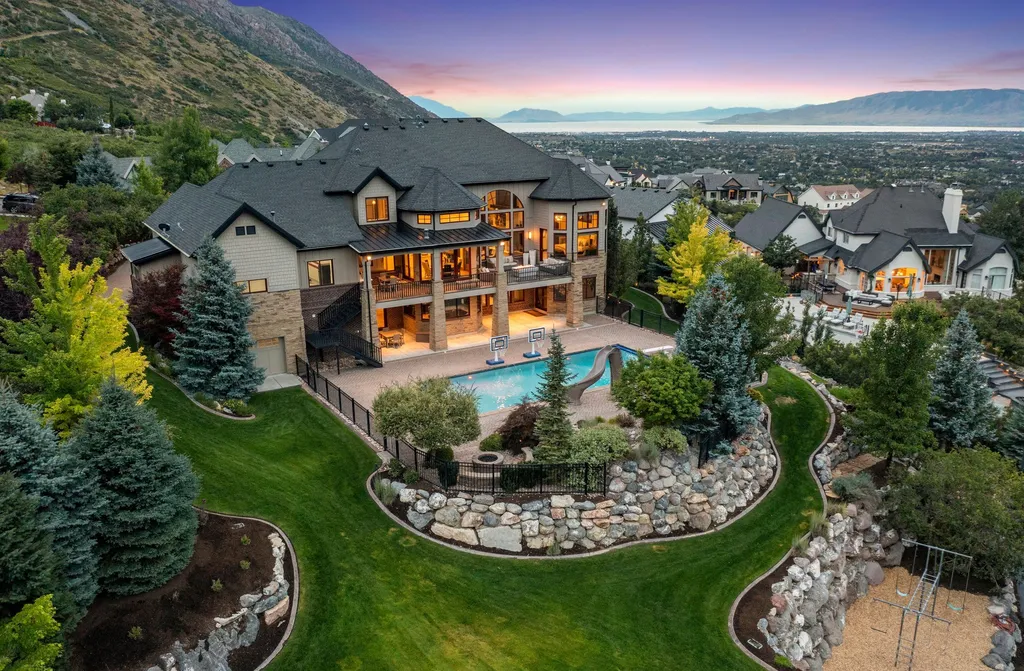 1643 E Box Elder Drive Home in Alpine, Utah. Few homes capture the majesty and beauty of Alpine's surrounding mountains like this one. This former parade of homes prize winner boasts panoramic views from every room. Impeccable attention to detail is evident throughout, with beautiful wood trim accentuating the warmth of the gathering areas. 