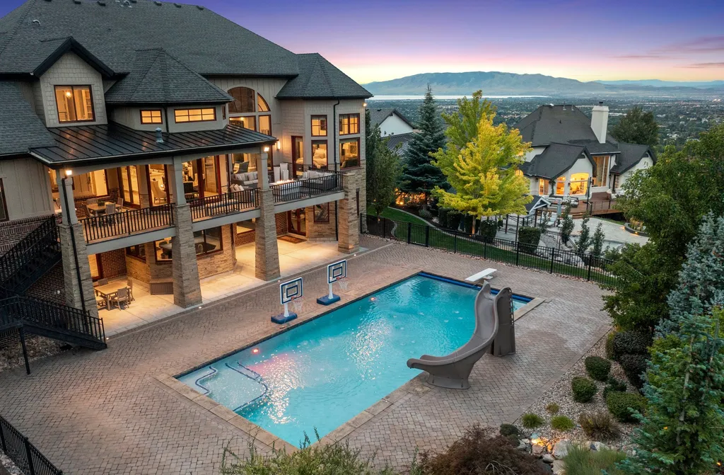 1643 E Box Elder Drive Home in Alpine, Utah. Few homes capture the majesty and beauty of Alpine's surrounding mountains like this one. This former parade of homes prize winner boasts panoramic views from every room. Impeccable attention to detail is evident throughout, with beautiful wood trim accentuating the warmth of the gathering areas. 