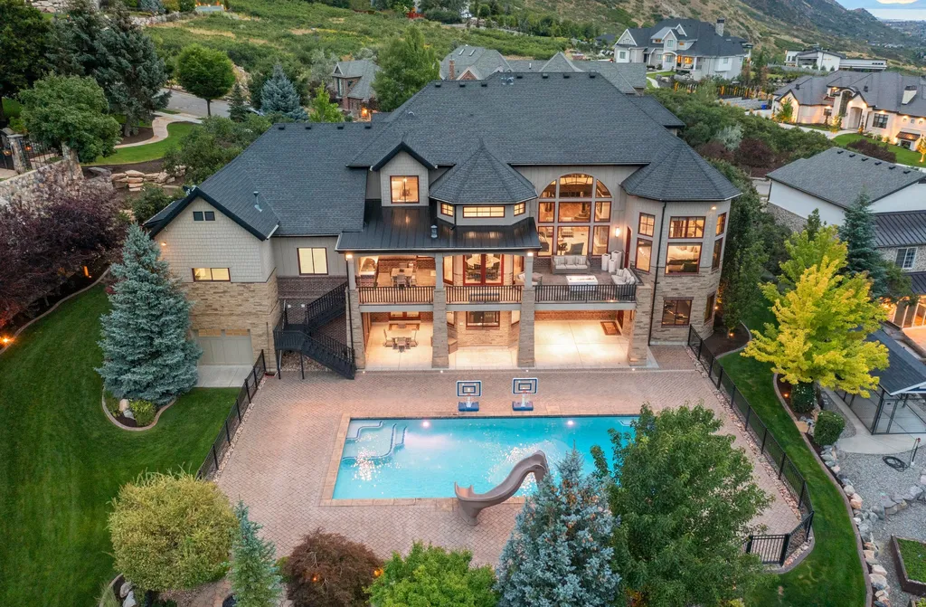 1643 E Box Elder Drive Home in Alpine, Utah. Few homes capture the majesty and beauty of Alpine's surrounding mountains like this one. This former parade of homes prize winner boasts panoramic views from every room. Impeccable attention to detail is evident throughout, with beautiful wood trim accentuating the warmth of the gathering areas. 