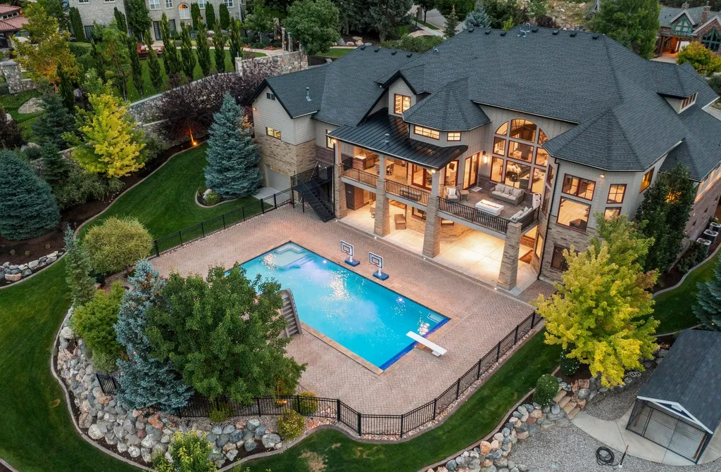 1643 E Box Elder Drive Home in Alpine, Utah. Few homes capture the majesty and beauty of Alpine's surrounding mountains like this one. This former parade of homes prize winner boasts panoramic views from every room. Impeccable attention to detail is evident throughout, with beautiful wood trim accentuating the warmth of the gathering areas. 