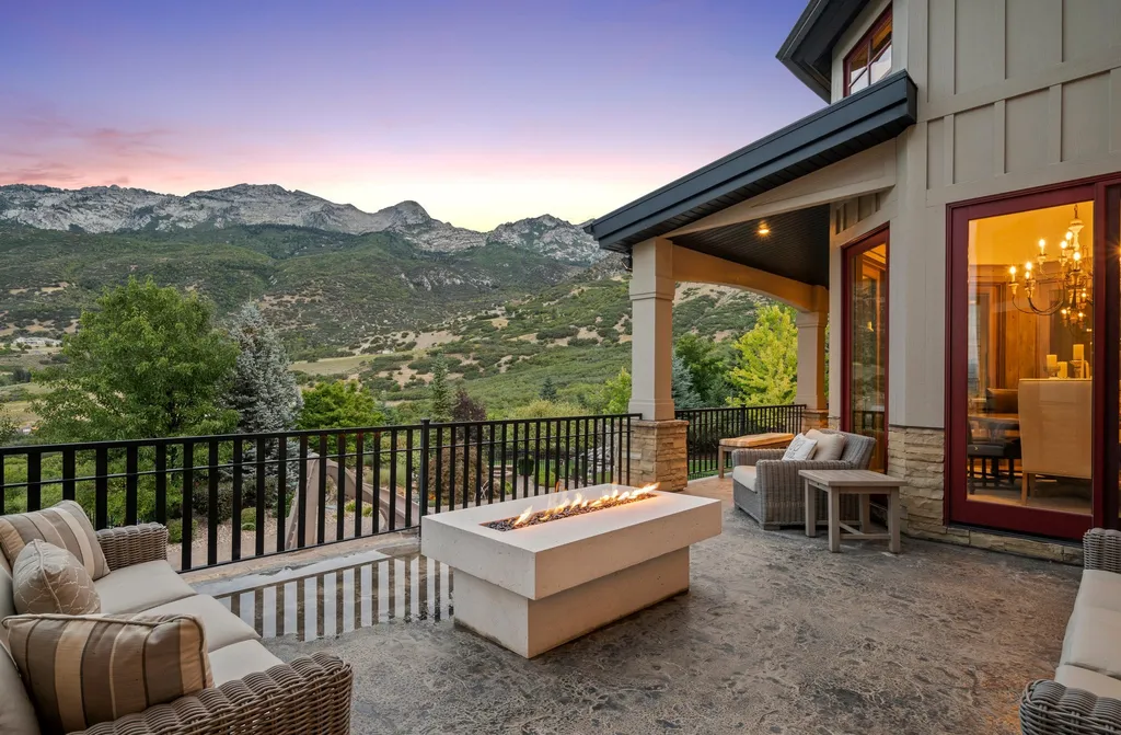 1643 E Box Elder Drive Home in Alpine, Utah. Few homes capture the majesty and beauty of Alpine's surrounding mountains like this one. This former parade of homes prize winner boasts panoramic views from every room. Impeccable attention to detail is evident throughout, with beautiful wood trim accentuating the warmth of the gathering areas. 