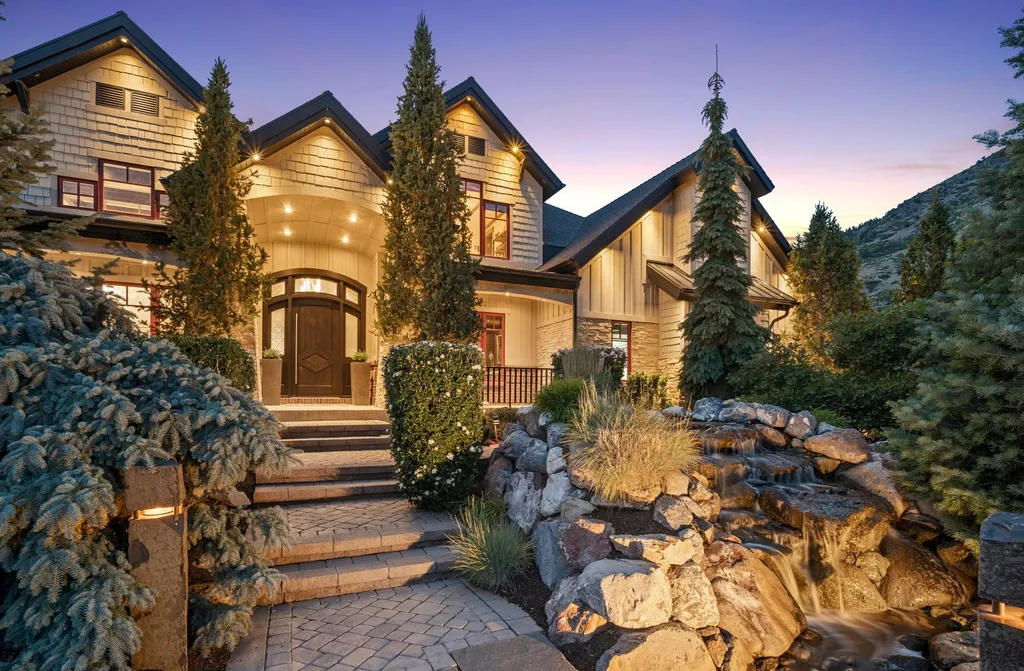 1643 E Box Elder Drive Home in Alpine, Utah. Few homes capture the majesty and beauty of Alpine's surrounding mountains like this one. This former parade of homes prize winner boasts panoramic views from every room. Impeccable attention to detail is evident throughout, with beautiful wood trim accentuating the warmth of the gathering areas. 