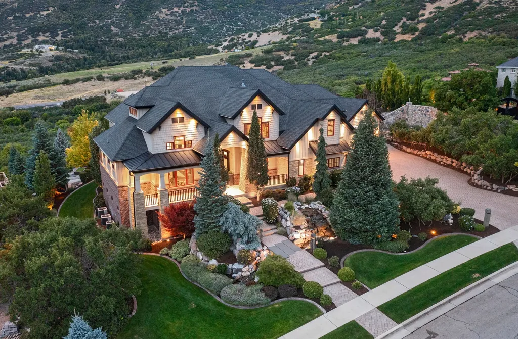 1643 E Box Elder Drive Home in Alpine, Utah. Few homes capture the majesty and beauty of Alpine's surrounding mountains like this one. This former parade of homes prize winner boasts panoramic views from every room. Impeccable attention to detail is evident throughout, with beautiful wood trim accentuating the warmth of the gathering areas. 