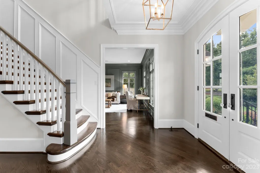 This stately transitional Myers Park home is situated on a large lot and features a spacious floor plan, a gourmet kitchen, a large pool with hot tub and water features, a newly built pool house with full bathroom, laundry, and outdoor patio with fireplace, and a newly built sport court that can act as a basketball court, pickleball court, volley ball, and tennis court. It is conveniently located to everything!