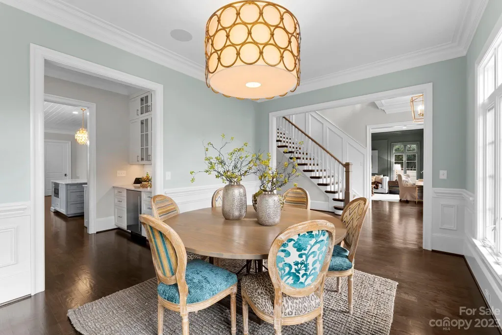 This stately transitional Myers Park home is situated on a large lot and features a spacious floor plan, a gourmet kitchen, a large pool with hot tub and water features, a newly built pool house with full bathroom, laundry, and outdoor patio with fireplace, and a newly built sport court that can act as a basketball court, pickleball court, volley ball, and tennis court. It is conveniently located to everything!
