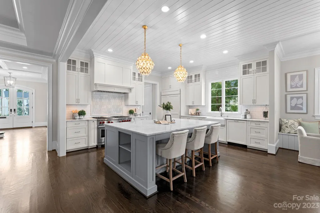 This stately transitional Myers Park home is situated on a large lot and features a spacious floor plan, a gourmet kitchen, a large pool with hot tub and water features, a newly built pool house with full bathroom, laundry, and outdoor patio with fireplace, and a newly built sport court that can act as a basketball court, pickleball court, volley ball, and tennis court. It is conveniently located to everything!
