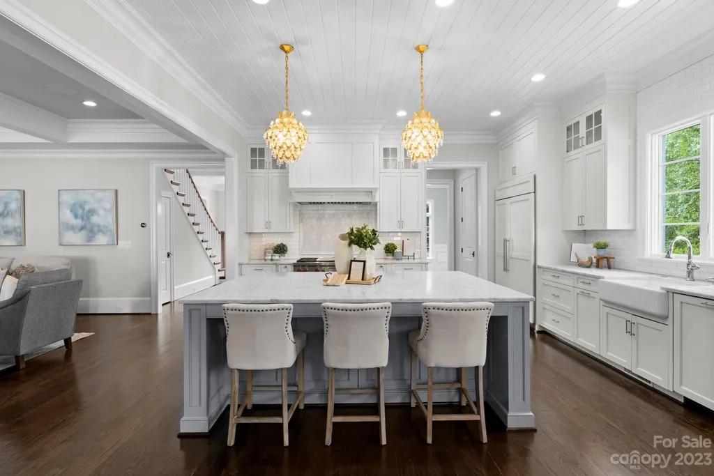 This stately transitional Myers Park home is situated on a large lot and features a spacious floor plan, a gourmet kitchen, a large pool with hot tub and water features, a newly built pool house with full bathroom, laundry, and outdoor patio with fireplace, and a newly built sport court that can act as a basketball court, pickleball court, volley ball, and tennis court. It is conveniently located to everything!