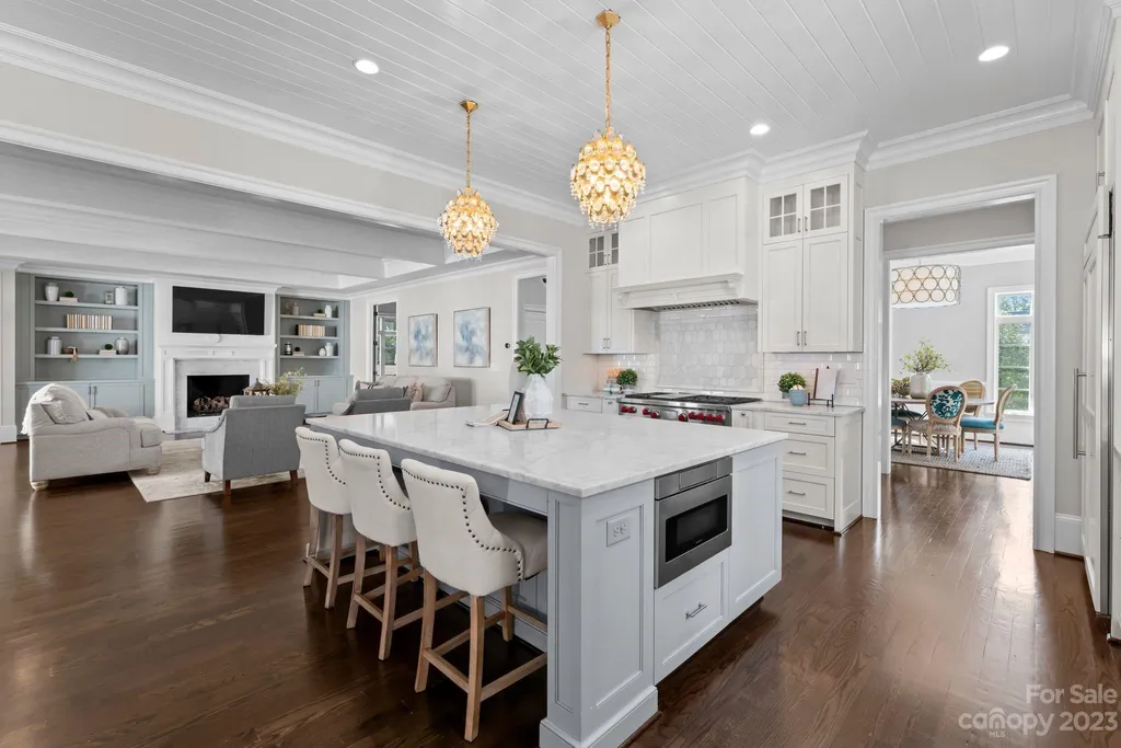 This stately transitional Myers Park home is situated on a large lot and features a spacious floor plan, a gourmet kitchen, a large pool with hot tub and water features, a newly built pool house with full bathroom, laundry, and outdoor patio with fireplace, and a newly built sport court that can act as a basketball court, pickleball court, volley ball, and tennis court. It is conveniently located to everything!