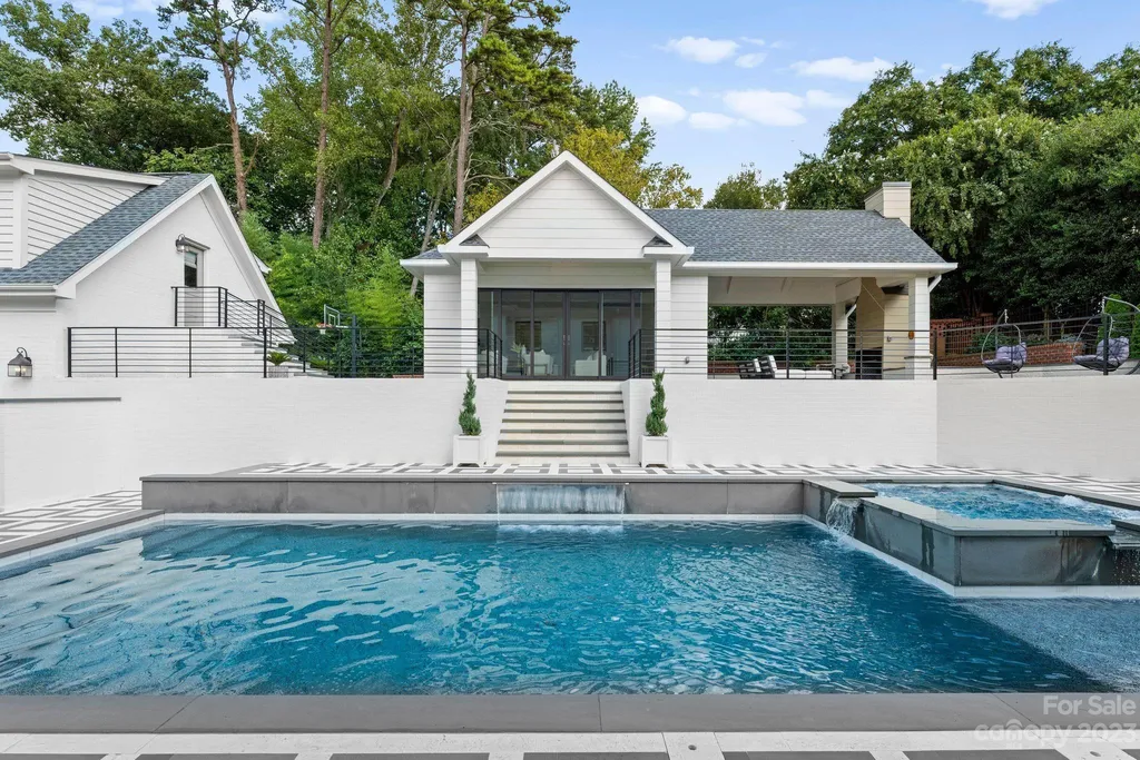 This stately transitional Myers Park home is situated on a large lot and features a spacious floor plan, a gourmet kitchen, a large pool with hot tub and water features, a newly built pool house with full bathroom, laundry, and outdoor patio with fireplace, and a newly built sport court that can act as a basketball court, pickleball court, volley ball, and tennis court. It is conveniently located to everything!