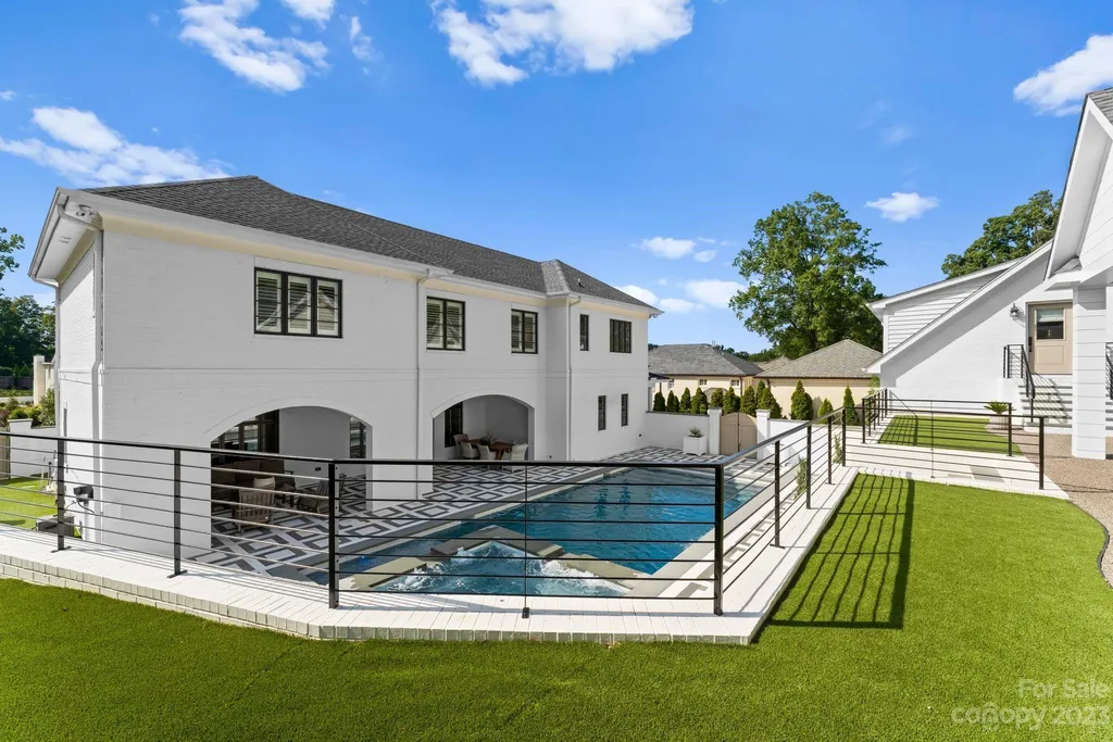 This stately transitional Myers Park home is situated on a large lot and features a spacious floor plan, a gourmet kitchen, a large pool with hot tub and water features, a newly built pool house with full bathroom, laundry, and outdoor patio with fireplace, and a newly built sport court that can act as a basketball court, pickleball court, volley ball, and tennis court. It is conveniently located to everything!