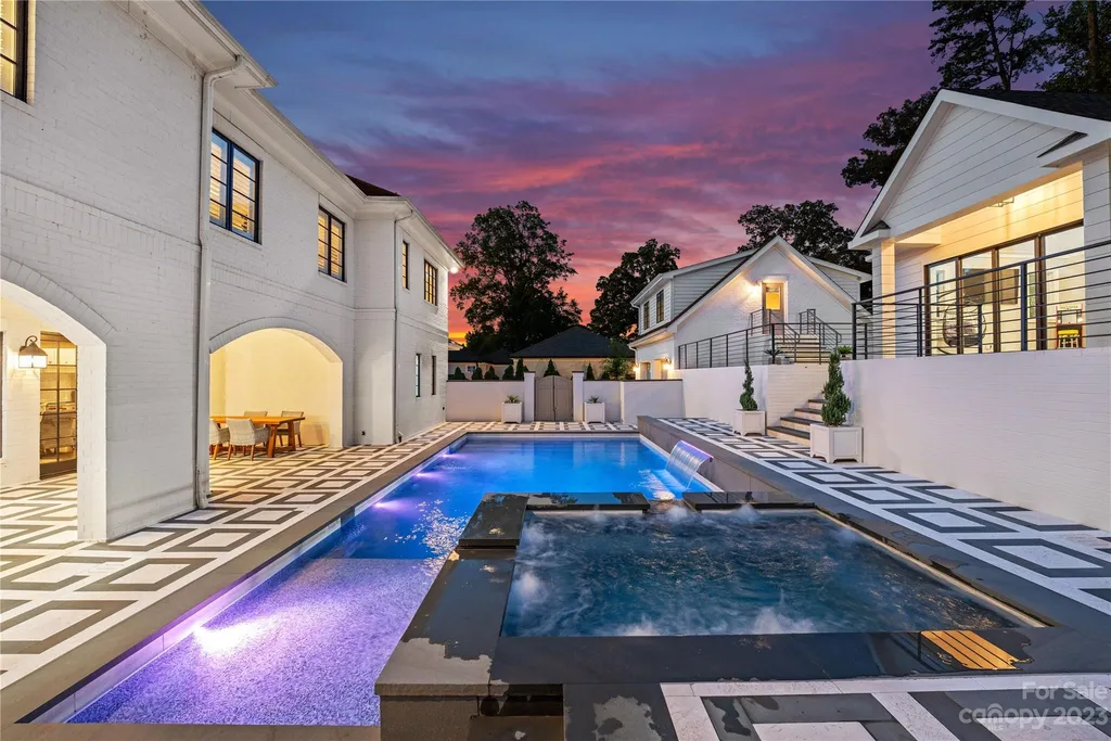 This stately transitional Myers Park home is situated on a large lot and features a spacious floor plan, a gourmet kitchen, a large pool with hot tub and water features, a newly built pool house with full bathroom, laundry, and outdoor patio with fireplace, and a newly built sport court that can act as a basketball court, pickleball court, volley ball, and tennis court. It is conveniently located to everything!