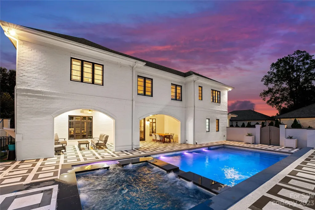 This stately transitional Myers Park home is situated on a large lot and features a spacious floor plan, a gourmet kitchen, a large pool with hot tub and water features, a newly built pool house with full bathroom, laundry, and outdoor patio with fireplace, and a newly built sport court that can act as a basketball court, pickleball court, volley ball, and tennis court. It is conveniently located to everything!
