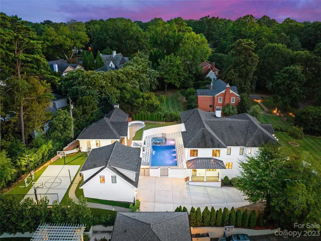 This stately transitional Myers Park home is situated on a large lot and features a spacious floor plan, a gourmet kitchen, a large pool with hot tub and water features, a newly built pool house with full bathroom, laundry, and outdoor patio with fireplace, and a newly built sport court that can act as a basketball court, pickleball court, volley ball, and tennis court. It is conveniently located to everything!