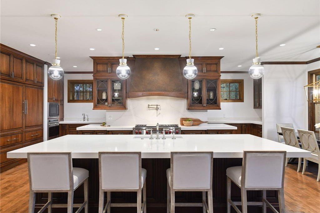 20630 Linwood Road Home in Excelsior, Minnesota. Welcome to 20630 Linwood Road, an exquisite gated estate nestled on two acres in the heart of Cottagewood USA, boasting 134 feet of premium northwest-facing, sandy, level lakeshore on Lake Minnetonka.