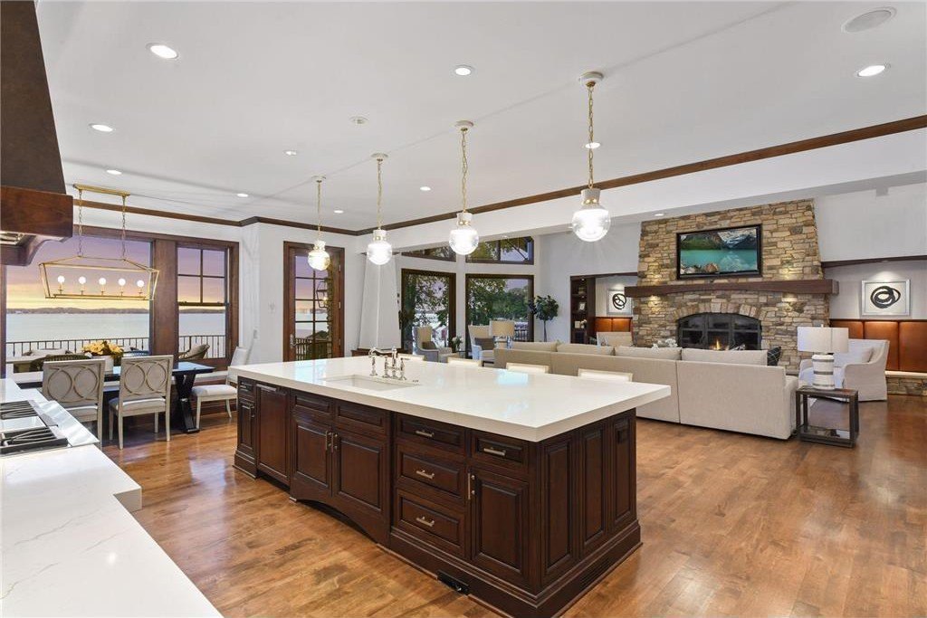20630 Linwood Road Home in Excelsior, Minnesota. Welcome to 20630 Linwood Road, an exquisite gated estate nestled on two acres in the heart of Cottagewood USA, boasting 134 feet of premium northwest-facing, sandy, level lakeshore on Lake Minnetonka.
