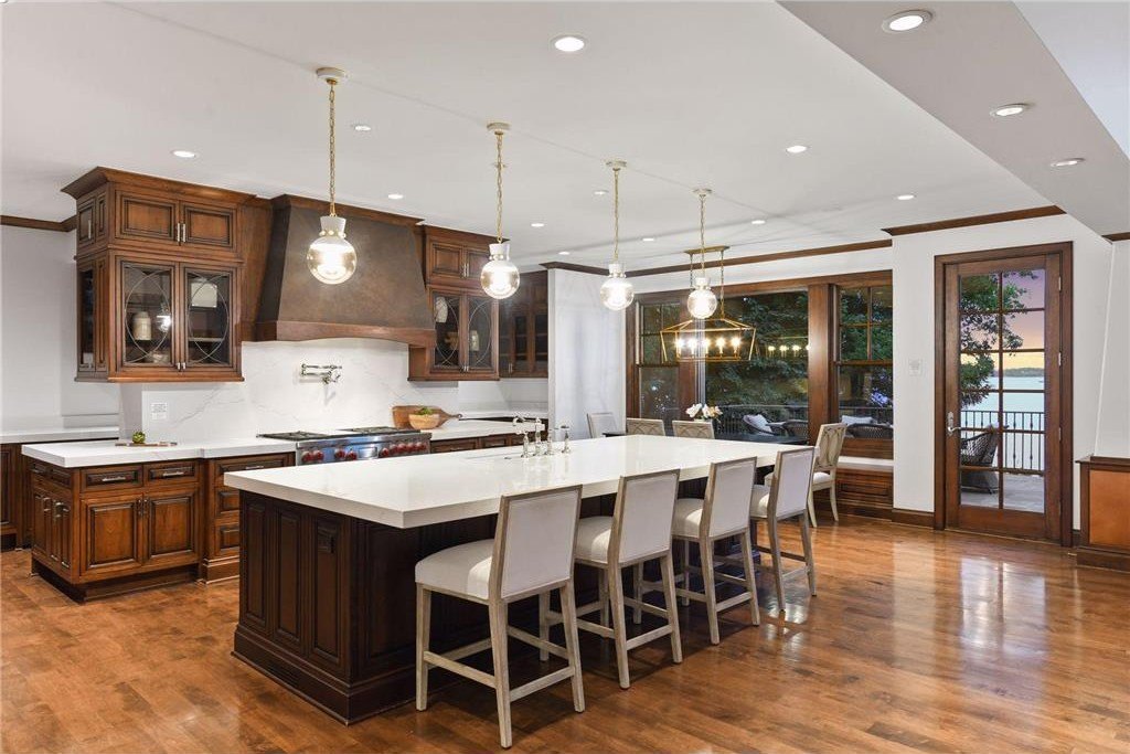 20630 Linwood Road Home in Excelsior, Minnesota. Welcome to 20630 Linwood Road, an exquisite gated estate nestled on two acres in the heart of Cottagewood USA, boasting 134 feet of premium northwest-facing, sandy, level lakeshore on Lake Minnetonka.