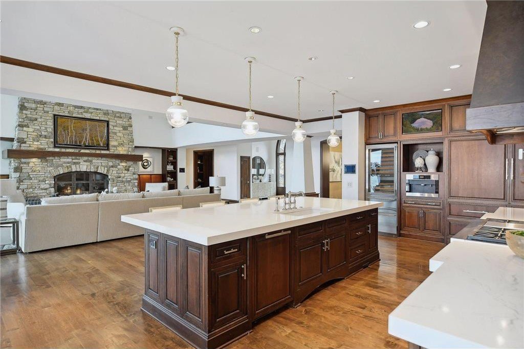 20630 Linwood Road Home in Excelsior, Minnesota. Welcome to 20630 Linwood Road, an exquisite gated estate nestled on two acres in the heart of Cottagewood USA, boasting 134 feet of premium northwest-facing, sandy, level lakeshore on Lake Minnetonka.