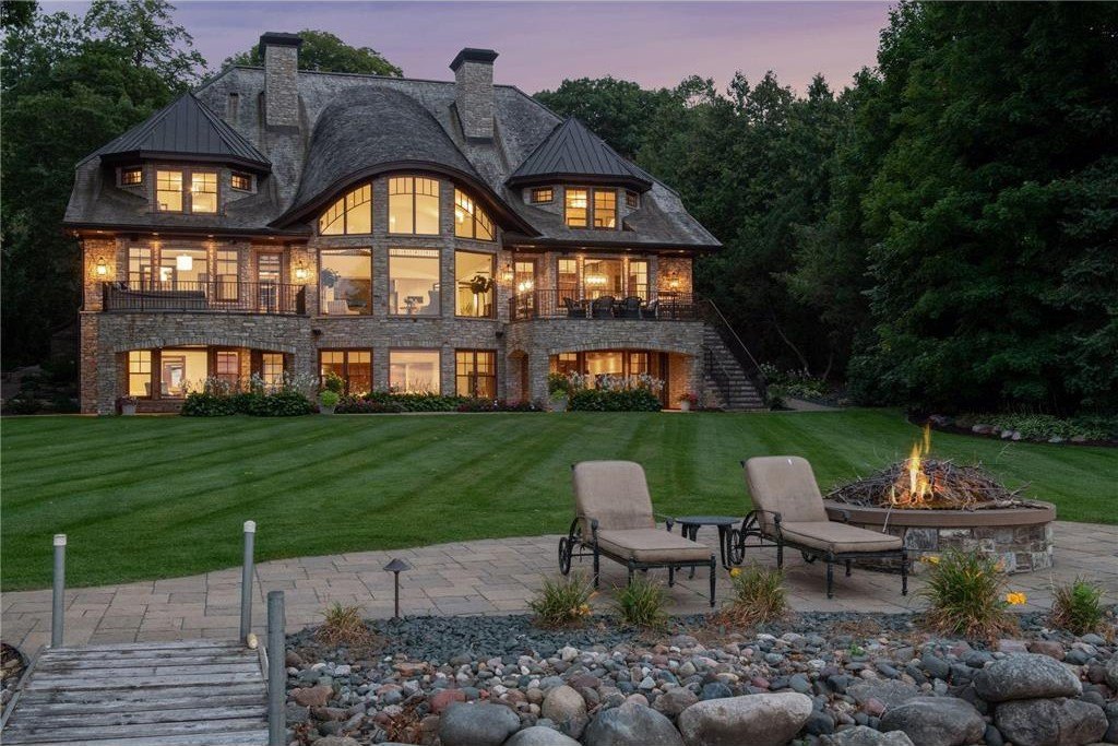 20630 Linwood Road Home in Excelsior, Minnesota. Welcome to 20630 Linwood Road, an exquisite gated estate nestled on two acres in the heart of Cottagewood USA, boasting 134 feet of premium northwest-facing, sandy, level lakeshore on Lake Minnetonka.