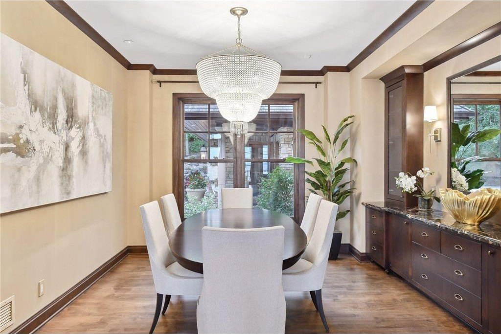20630 Linwood Road Home in Excelsior, Minnesota. Welcome to 20630 Linwood Road, an exquisite gated estate nestled on two acres in the heart of Cottagewood USA, boasting 134 feet of premium northwest-facing, sandy, level lakeshore on Lake Minnetonka.