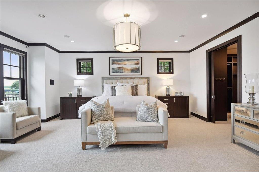 20630 Linwood Road Home in Excelsior, Minnesota. Welcome to 20630 Linwood Road, an exquisite gated estate nestled on two acres in the heart of Cottagewood USA, boasting 134 feet of premium northwest-facing, sandy, level lakeshore on Lake Minnetonka.