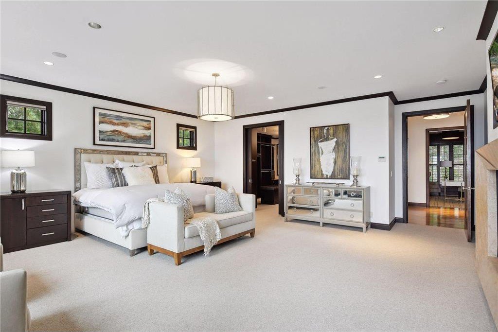 20630 Linwood Road Home in Excelsior, Minnesota. Welcome to 20630 Linwood Road, an exquisite gated estate nestled on two acres in the heart of Cottagewood USA, boasting 134 feet of premium northwest-facing, sandy, level lakeshore on Lake Minnetonka.