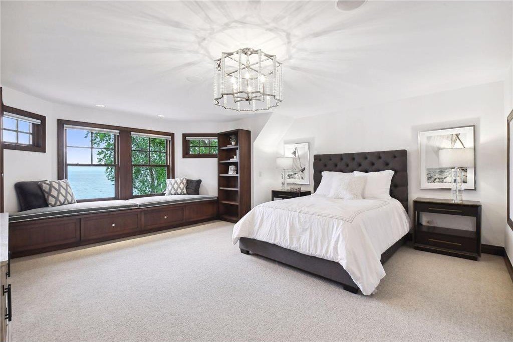 20630 Linwood Road Home in Excelsior, Minnesota. Welcome to 20630 Linwood Road, an exquisite gated estate nestled on two acres in the heart of Cottagewood USA, boasting 134 feet of premium northwest-facing, sandy, level lakeshore on Lake Minnetonka.
