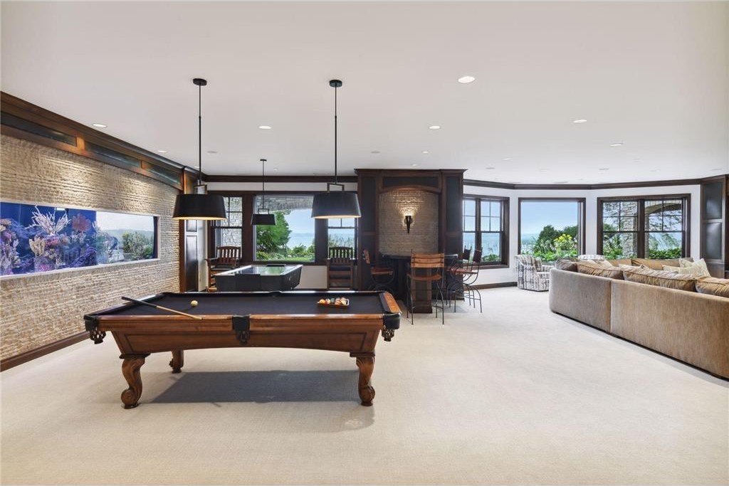 20630 Linwood Road Home in Excelsior, Minnesota. Welcome to 20630 Linwood Road, an exquisite gated estate nestled on two acres in the heart of Cottagewood USA, boasting 134 feet of premium northwest-facing, sandy, level lakeshore on Lake Minnetonka.