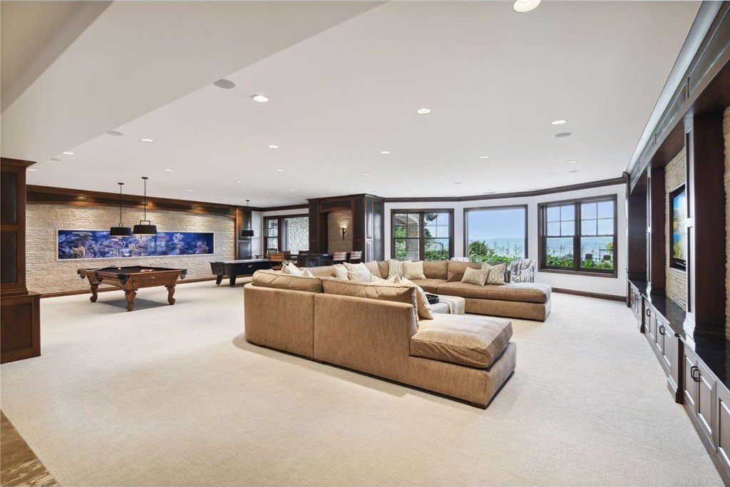 20630 Linwood Road Home in Excelsior, Minnesota. Welcome to 20630 Linwood Road, an exquisite gated estate nestled on two acres in the heart of Cottagewood USA, boasting 134 feet of premium northwest-facing, sandy, level lakeshore on Lake Minnetonka.