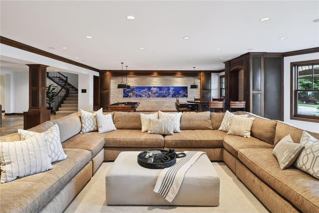 20630 Linwood Road Home in Excelsior, Minnesota. Welcome to 20630 Linwood Road, an exquisite gated estate nestled on two acres in the heart of Cottagewood USA, boasting 134 feet of premium northwest-facing, sandy, level lakeshore on Lake Minnetonka.