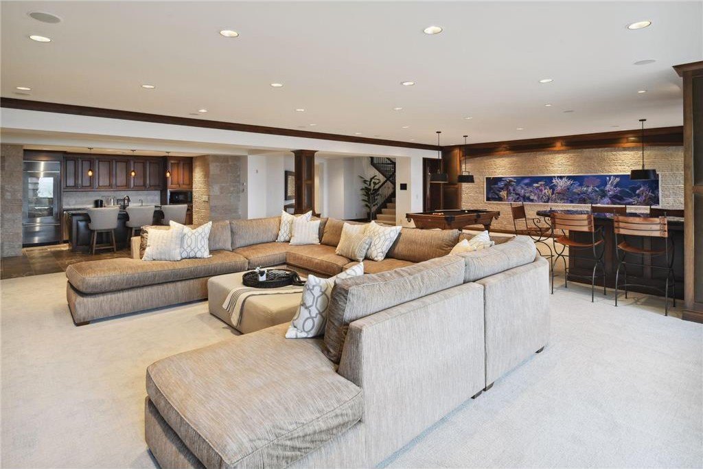 20630 Linwood Road Home in Excelsior, Minnesota. Welcome to 20630 Linwood Road, an exquisite gated estate nestled on two acres in the heart of Cottagewood USA, boasting 134 feet of premium northwest-facing, sandy, level lakeshore on Lake Minnetonka.