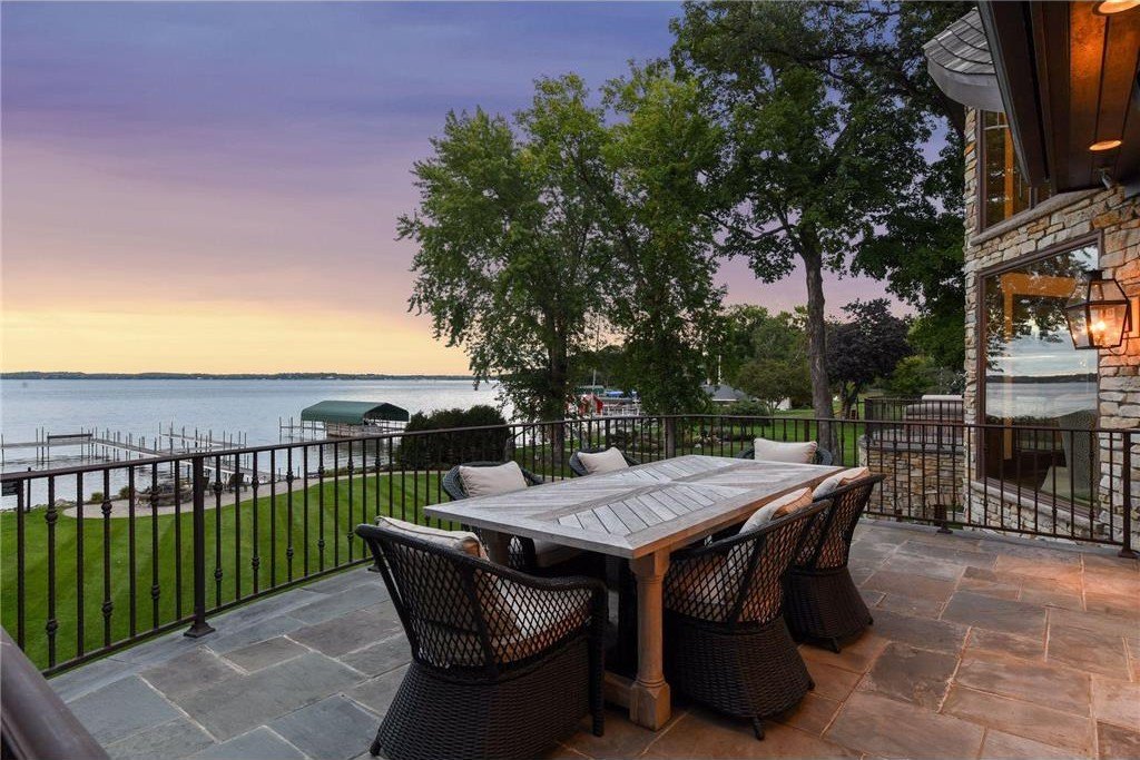 20630 Linwood Road Home in Excelsior, Minnesota. Welcome to 20630 Linwood Road, an exquisite gated estate nestled on two acres in the heart of Cottagewood USA, boasting 134 feet of premium northwest-facing, sandy, level lakeshore on Lake Minnetonka.