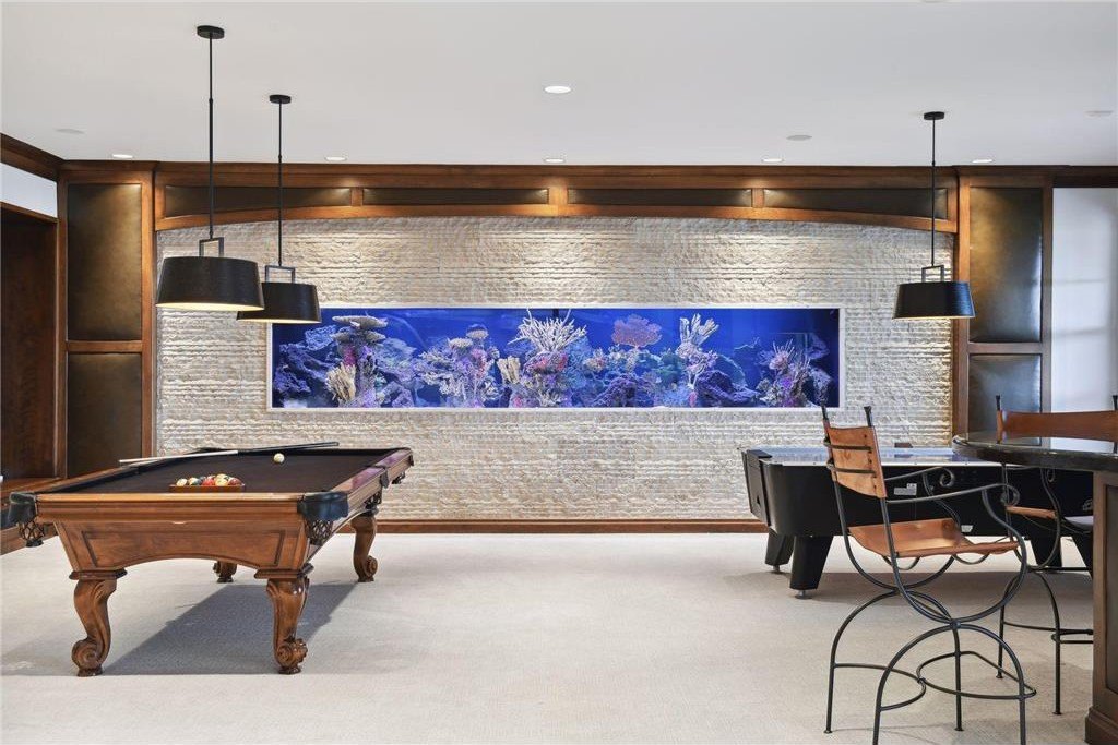 20630 Linwood Road Home in Excelsior, Minnesota. Welcome to 20630 Linwood Road, an exquisite gated estate nestled on two acres in the heart of Cottagewood USA, boasting 134 feet of premium northwest-facing, sandy, level lakeshore on Lake Minnetonka.