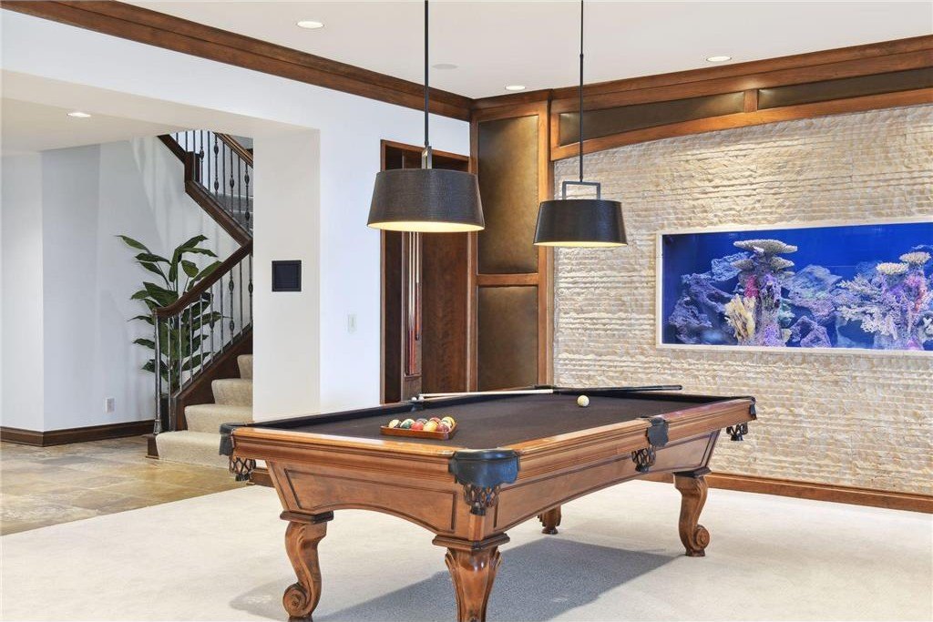 20630 Linwood Road Home in Excelsior, Minnesota. Welcome to 20630 Linwood Road, an exquisite gated estate nestled on two acres in the heart of Cottagewood USA, boasting 134 feet of premium northwest-facing, sandy, level lakeshore on Lake Minnetonka.