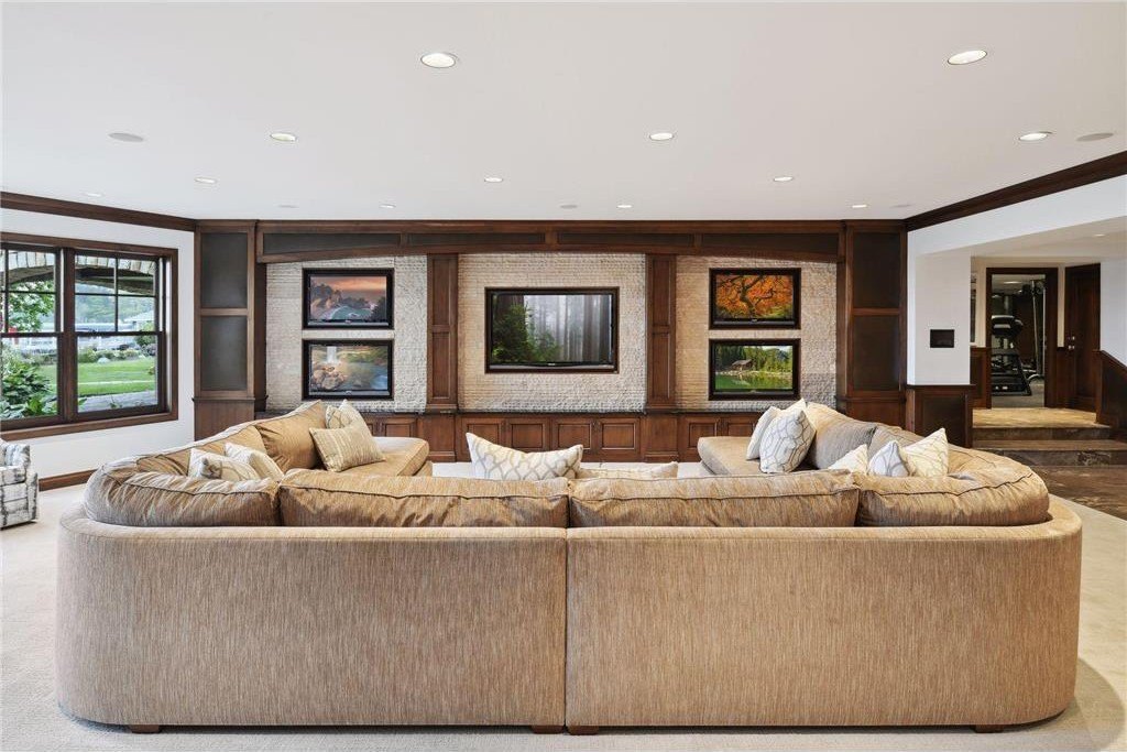20630 Linwood Road Home in Excelsior, Minnesota. Welcome to 20630 Linwood Road, an exquisite gated estate nestled on two acres in the heart of Cottagewood USA, boasting 134 feet of premium northwest-facing, sandy, level lakeshore on Lake Minnetonka.
