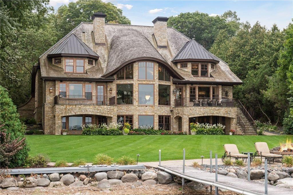 20630 Linwood Road Home in Excelsior, Minnesota. Welcome to 20630 Linwood Road, an exquisite gated estate nestled on two acres in the heart of Cottagewood USA, boasting 134 feet of premium northwest-facing, sandy, level lakeshore on Lake Minnetonka.