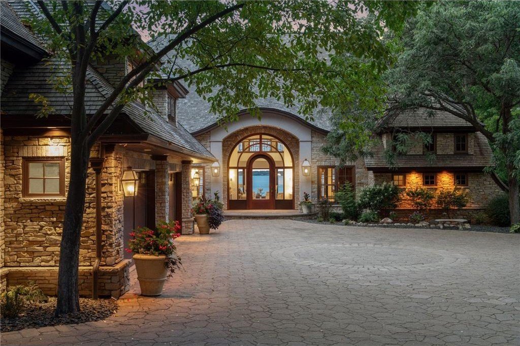 20630 Linwood Road Home in Excelsior, Minnesota. Welcome to 20630 Linwood Road, an exquisite gated estate nestled on two acres in the heart of Cottagewood USA, boasting 134 feet of premium northwest-facing, sandy, level lakeshore on Lake Minnetonka.