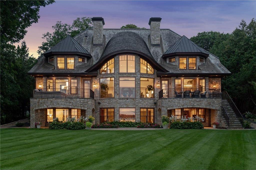 20630 Linwood Road Home in Excelsior, Minnesota. Welcome to 20630 Linwood Road, an exquisite gated estate nestled on two acres in the heart of Cottagewood USA, boasting 134 feet of premium northwest-facing, sandy, level lakeshore on Lake Minnetonka.