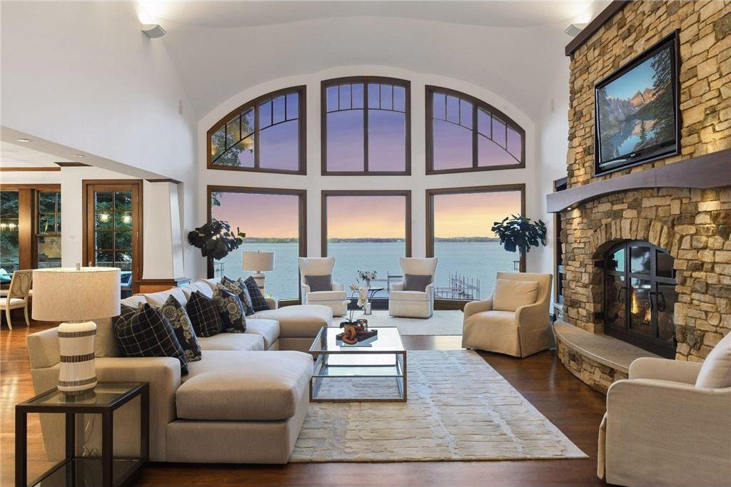 20630 Linwood Road Home in Excelsior, Minnesota. Welcome to 20630 Linwood Road, an exquisite gated estate nestled on two acres in the heart of Cottagewood USA, boasting 134 feet of premium northwest-facing, sandy, level lakeshore on Lake Minnetonka.