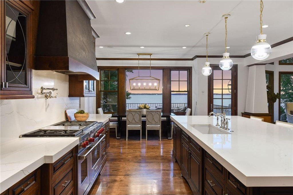 20630 Linwood Road Home in Excelsior, Minnesota. Welcome to 20630 Linwood Road, an exquisite gated estate nestled on two acres in the heart of Cottagewood USA, boasting 134 feet of premium northwest-facing, sandy, level lakeshore on Lake Minnetonka.