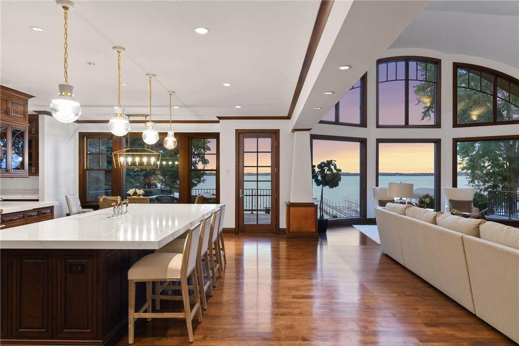 20630 Linwood Road Home in Excelsior, Minnesota. Welcome to 20630 Linwood Road, an exquisite gated estate nestled on two acres in the heart of Cottagewood USA, boasting 134 feet of premium northwest-facing, sandy, level lakeshore on Lake Minnetonka.