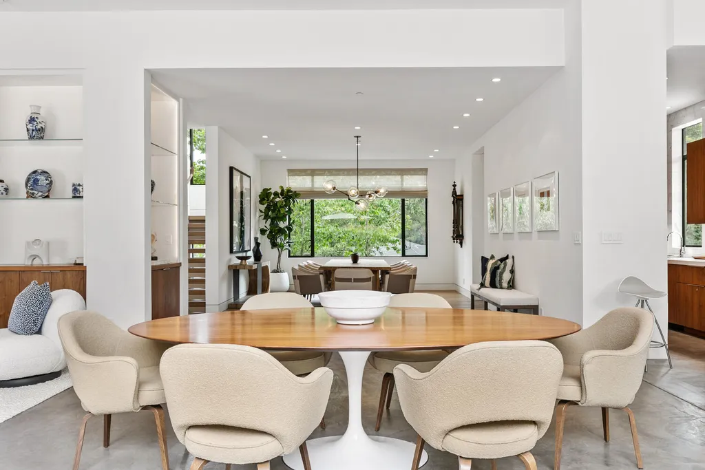 2140 Forest View Avenue Home in Hillsborough, California. Step into the future with this 2016-built contemporary masterpiece located on a premier street in lower North Hillsborough. Designed by architect Dan Phipps and constructed by Toboni Builders, this home is a model of sustainable living with features like solar power, radiant-heated concrete or oak floors, EV wiring, and a radiant deck-heated saltwater pool, all situated on just over half an acre.