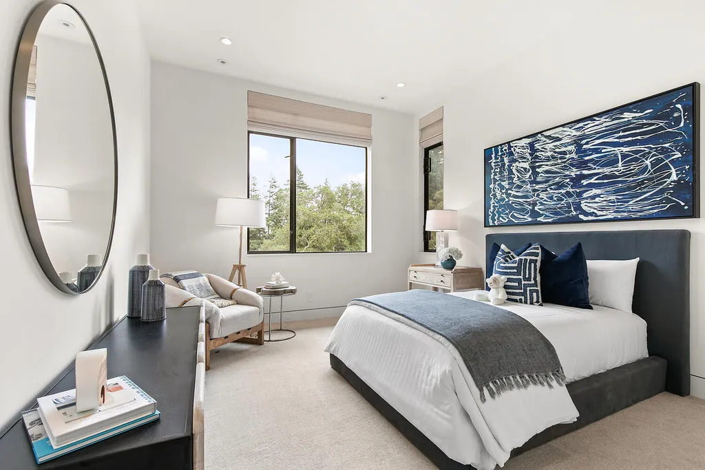 2140 Forest View Avenue Home in Hillsborough, California. Step into the future with this 2016-built contemporary masterpiece located on a premier street in lower North Hillsborough. Designed by architect Dan Phipps and constructed by Toboni Builders, this home is a model of sustainable living with features like solar power, radiant-heated concrete or oak floors, EV wiring, and a radiant deck-heated saltwater pool, all situated on just over half an acre.
