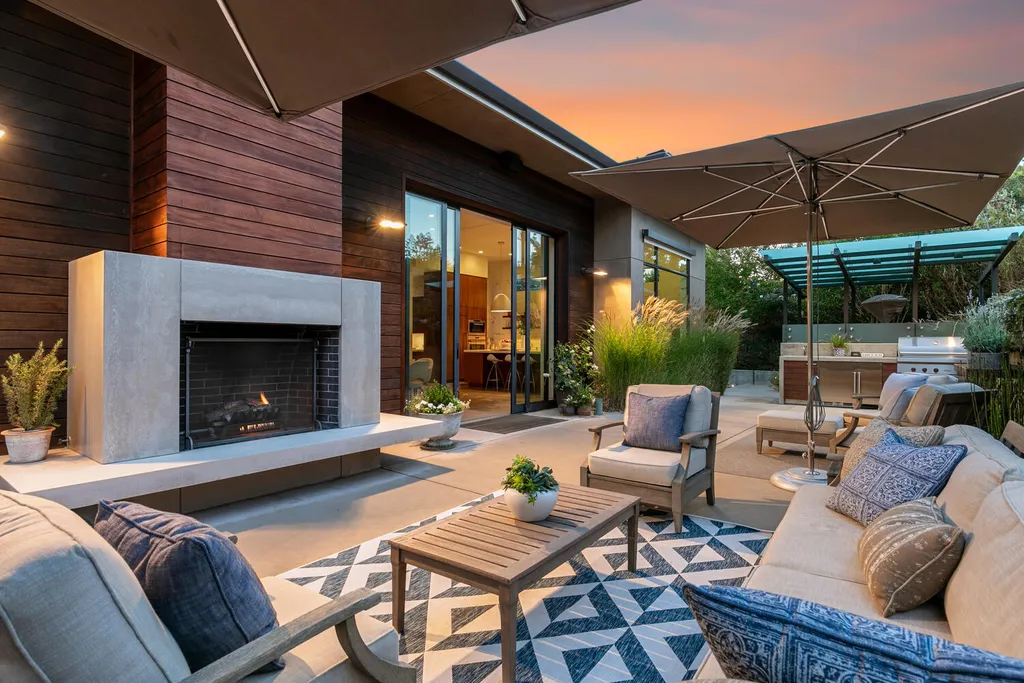 2140 Forest View Avenue Home in Hillsborough, California. Step into the future with this 2016-built contemporary masterpiece located on a premier street in lower North Hillsborough. Designed by architect Dan Phipps and constructed by Toboni Builders, this home is a model of sustainable living with features like solar power, radiant-heated concrete or oak floors, EV wiring, and a radiant deck-heated saltwater pool, all situated on just over half an acre.