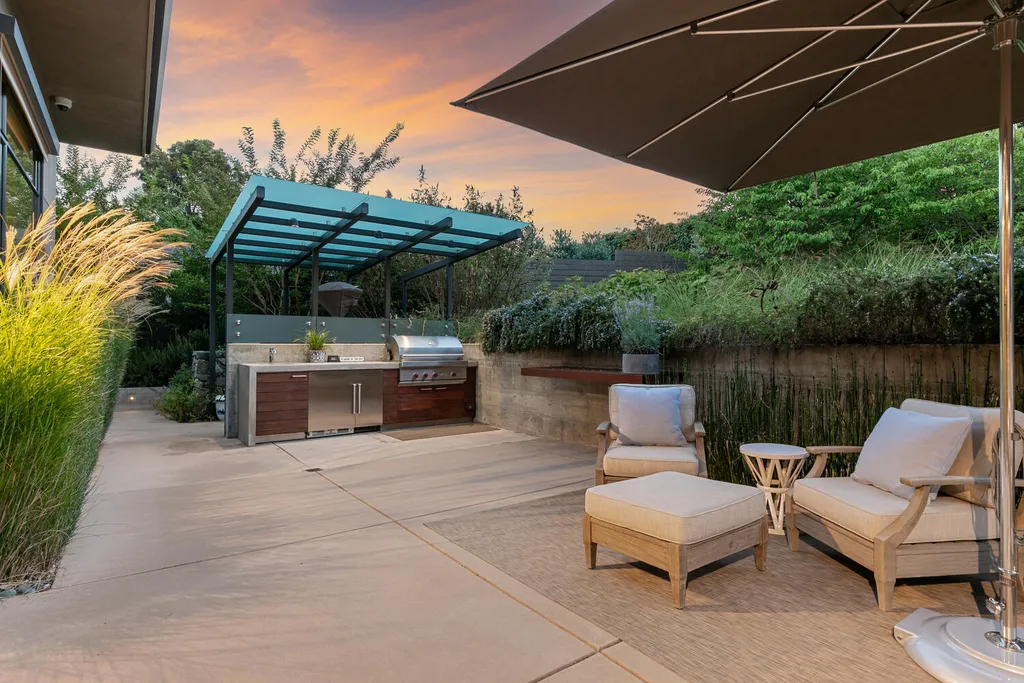2140 Forest View Avenue Home in Hillsborough, California. Step into the future with this 2016-built contemporary masterpiece located on a premier street in lower North Hillsborough. Designed by architect Dan Phipps and constructed by Toboni Builders, this home is a model of sustainable living with features like solar power, radiant-heated concrete or oak floors, EV wiring, and a radiant deck-heated saltwater pool, all situated on just over half an acre.