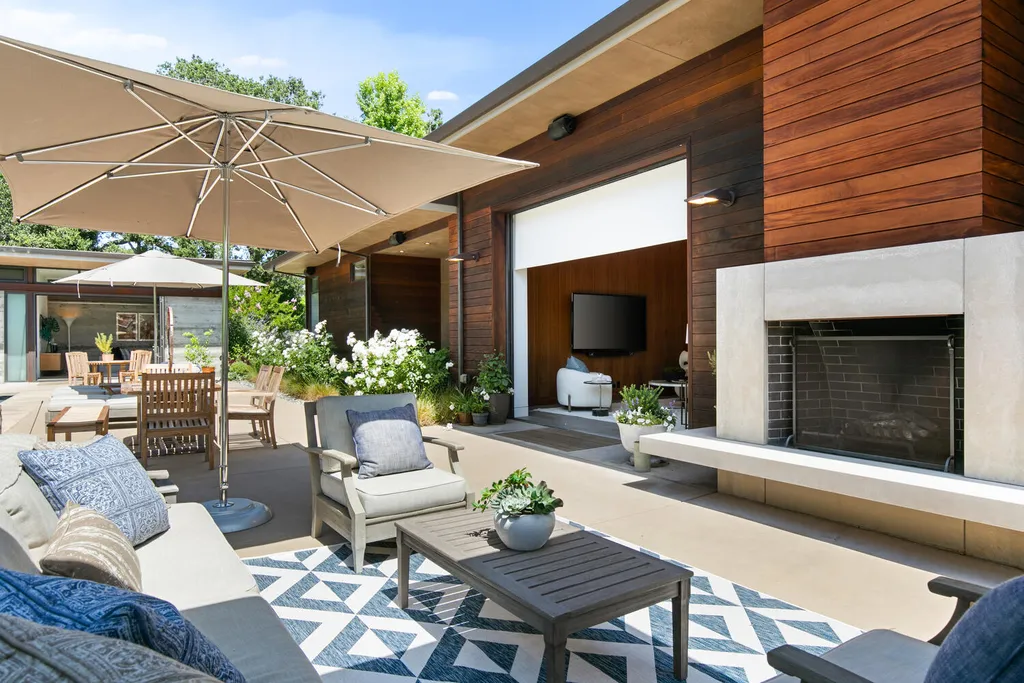 2140 Forest View Avenue Home in Hillsborough, California. Step into the future with this 2016-built contemporary masterpiece located on a premier street in lower North Hillsborough. Designed by architect Dan Phipps and constructed by Toboni Builders, this home is a model of sustainable living with features like solar power, radiant-heated concrete or oak floors, EV wiring, and a radiant deck-heated saltwater pool, all situated on just over half an acre.