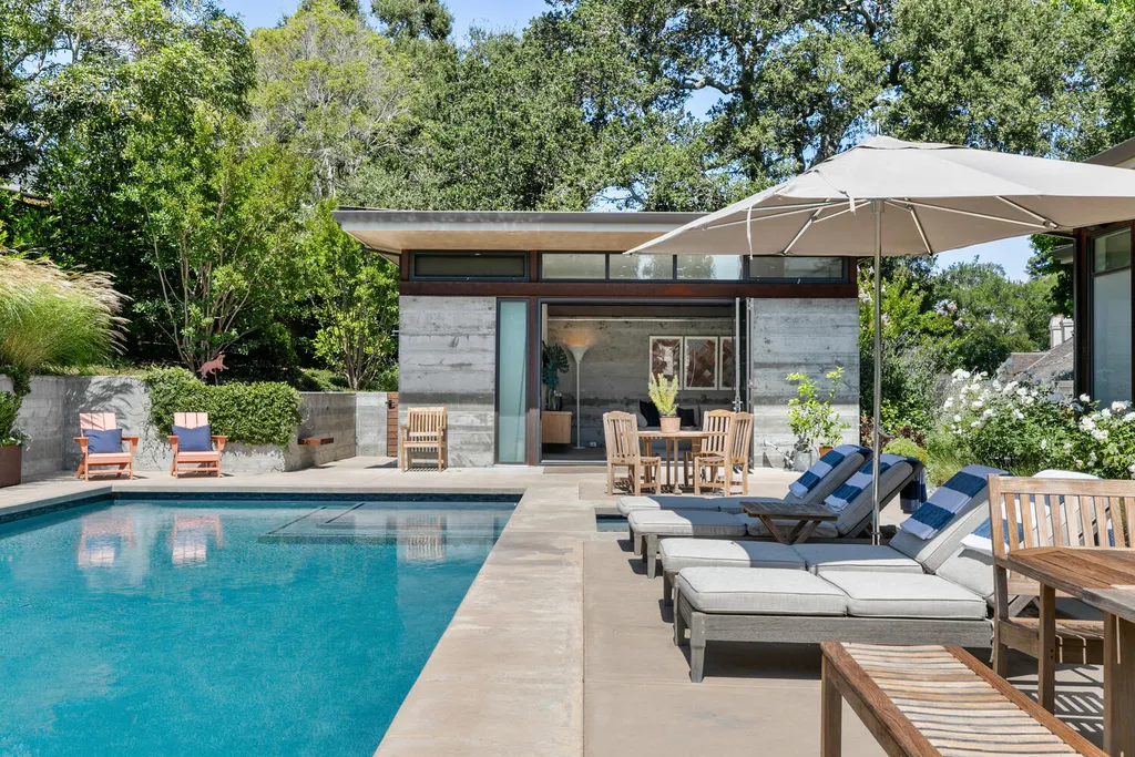 2140 Forest View Avenue Home in Hillsborough, California. Step into the future with this 2016-built contemporary masterpiece located on a premier street in lower North Hillsborough. Designed by architect Dan Phipps and constructed by Toboni Builders, this home is a model of sustainable living with features like solar power, radiant-heated concrete or oak floors, EV wiring, and a radiant deck-heated saltwater pool, all situated on just over half an acre.