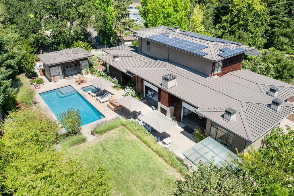 2140 Forest View Avenue Home in Hillsborough, California. Step into the future with this 2016-built contemporary masterpiece located on a premier street in lower North Hillsborough. Designed by architect Dan Phipps and constructed by Toboni Builders, this home is a model of sustainable living with features like solar power, radiant-heated concrete or oak floors, EV wiring, and a radiant deck-heated saltwater pool, all situated on just over half an acre.