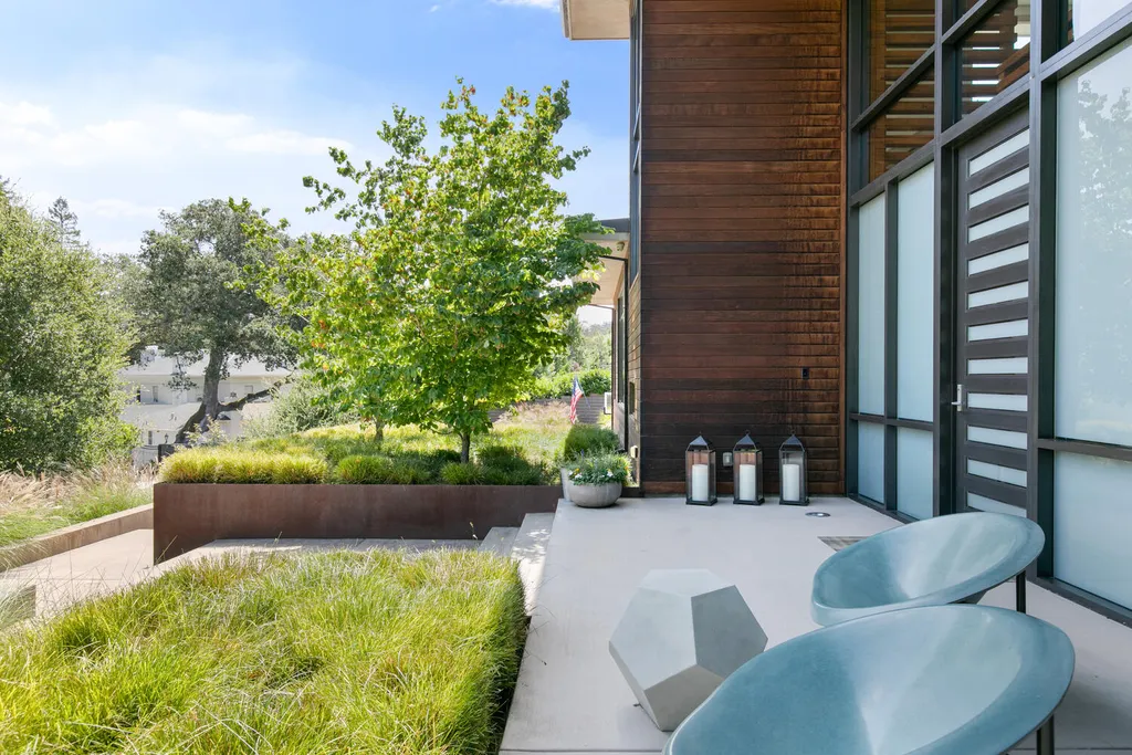 2140 Forest View Avenue Home in Hillsborough, California. Step into the future with this 2016-built contemporary masterpiece located on a premier street in lower North Hillsborough. Designed by architect Dan Phipps and constructed by Toboni Builders, this home is a model of sustainable living with features like solar power, radiant-heated concrete or oak floors, EV wiring, and a radiant deck-heated saltwater pool, all situated on just over half an acre.