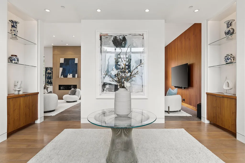 2140 Forest View Avenue Home in Hillsborough, California. Step into the future with this 2016-built contemporary masterpiece located on a premier street in lower North Hillsborough. Designed by architect Dan Phipps and constructed by Toboni Builders, this home is a model of sustainable living with features like solar power, radiant-heated concrete or oak floors, EV wiring, and a radiant deck-heated saltwater pool, all situated on just over half an acre.