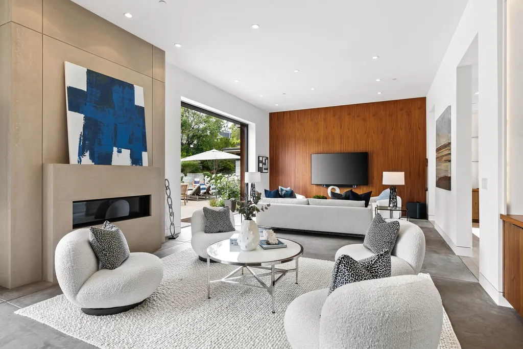 2140 Forest View Avenue Home in Hillsborough, California. Step into the future with this 2016-built contemporary masterpiece located on a premier street in lower North Hillsborough. Designed by architect Dan Phipps and constructed by Toboni Builders, this home is a model of sustainable living with features like solar power, radiant-heated concrete or oak floors, EV wiring, and a radiant deck-heated saltwater pool, all situated on just over half an acre.